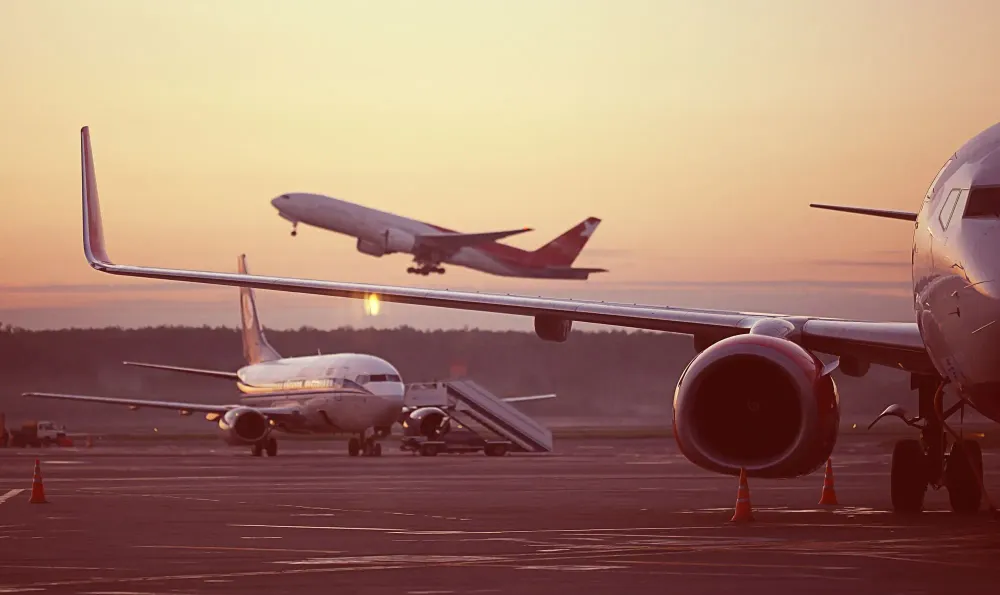 Airplanes on Tarmac and Taking Off Airfare Sale